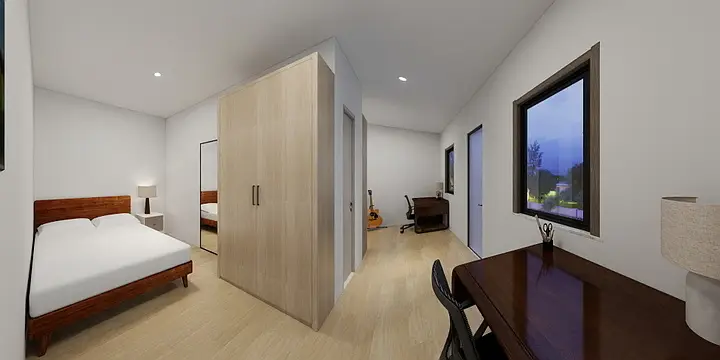 Interior of a private workforce housing bedroom with bed, wardrobe, desk and window